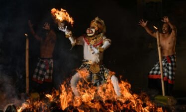 Dynamic Kecak dance with fire, showcasing Balinese cultural heritage.