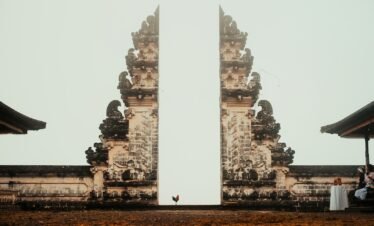 rooster in between concrete arch