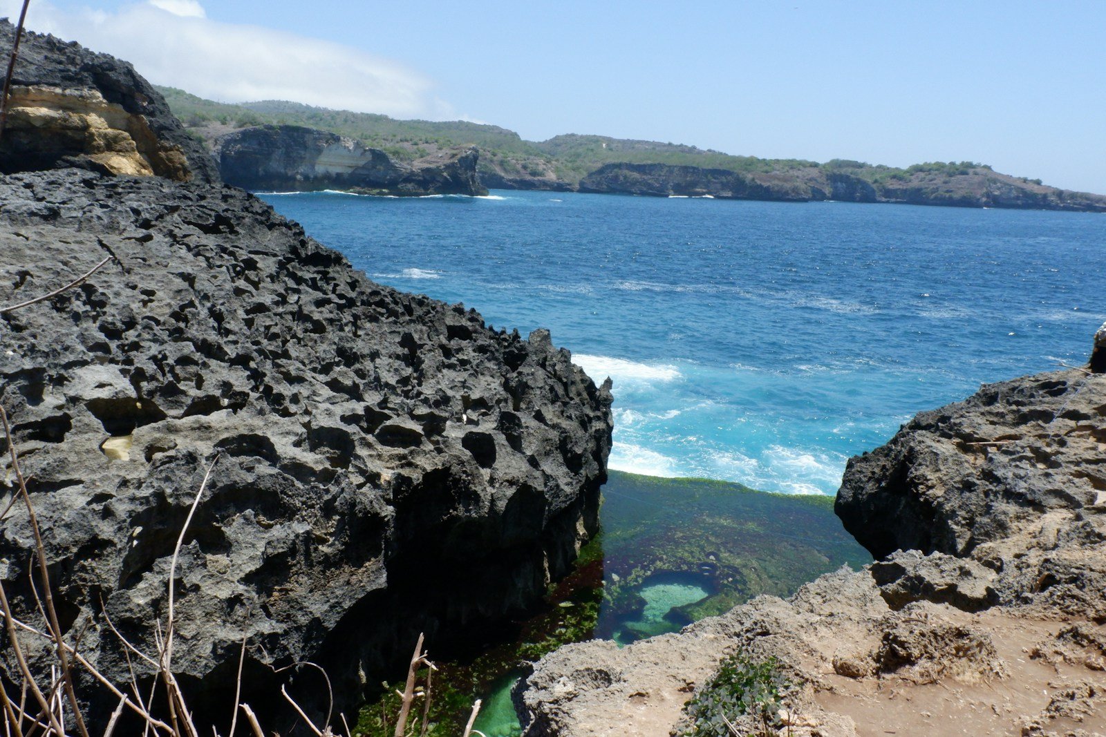 a view of the ocean from a cliff