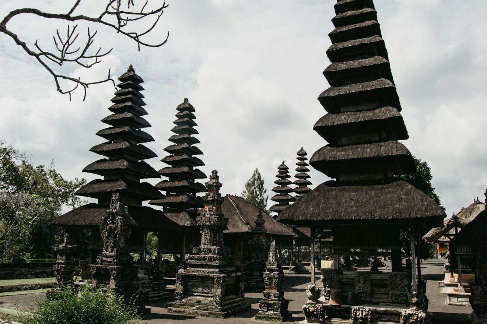 a group of stone structures with trees in the background