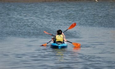 a person in a kayak on a body of water