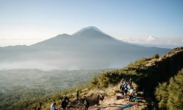 A group of people hiking up a mountain